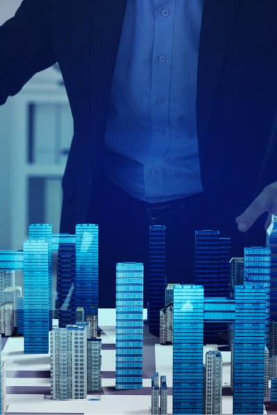 Engineers looking at a 3D building model (BIM) on a computer